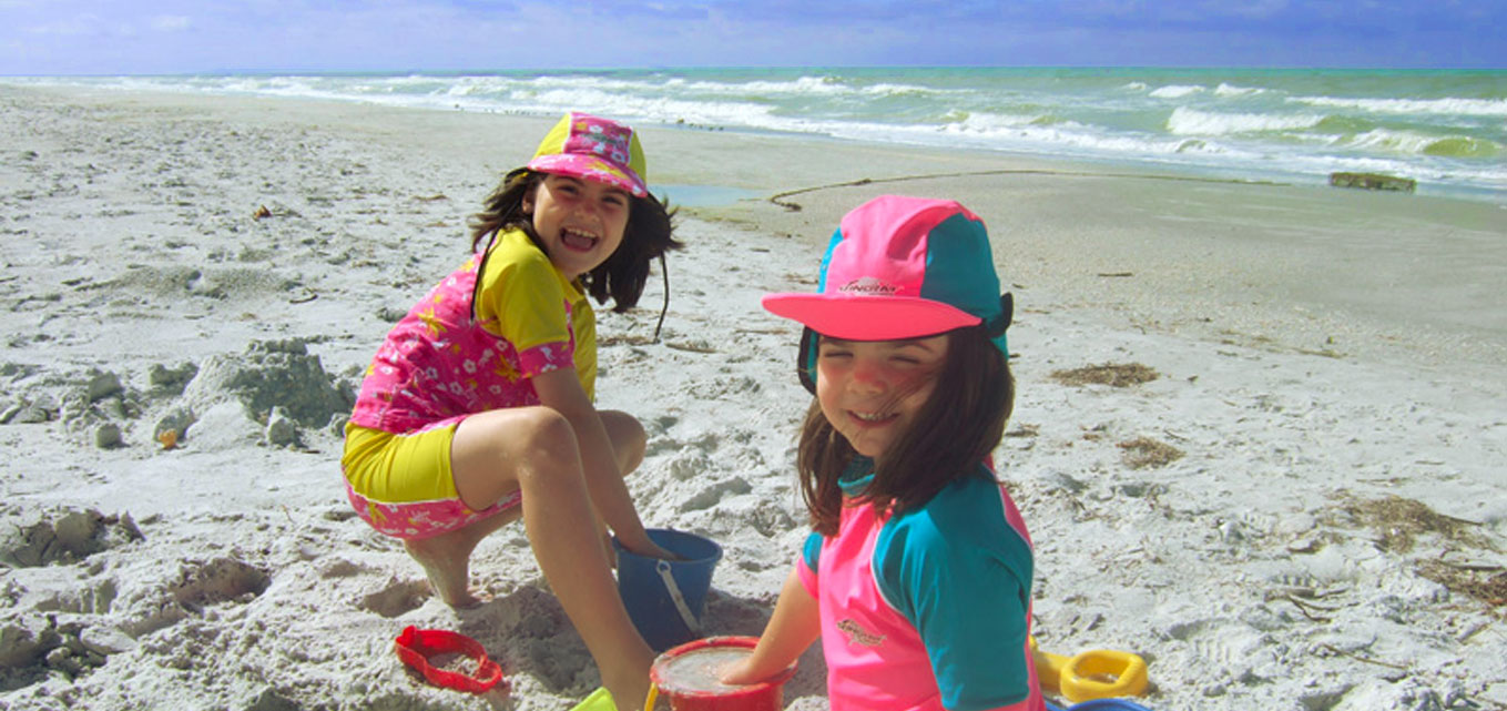 2 girls playing in the sand